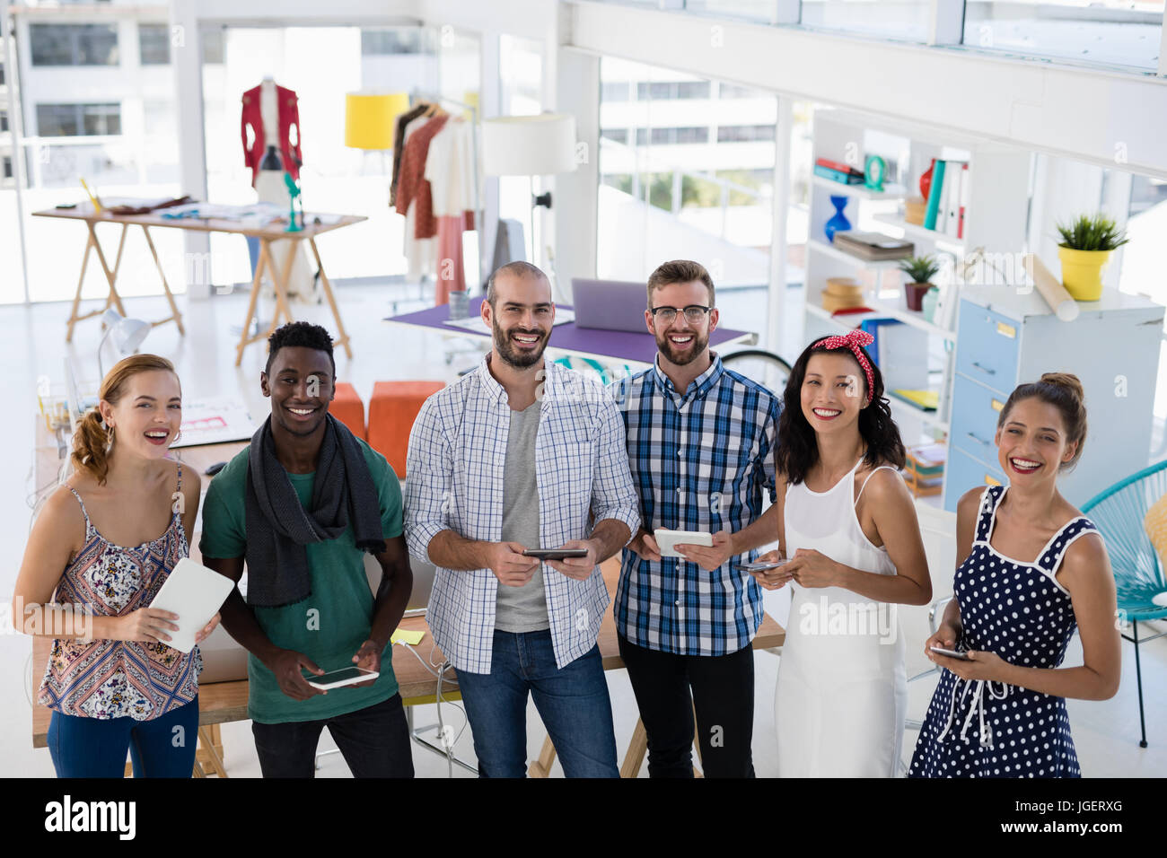 Portrait of business executives smiling in office Stock Photo - Alamy