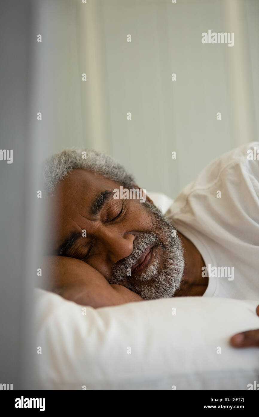 Elderly man asleep in bed hi-res stock photography and images - Alamy