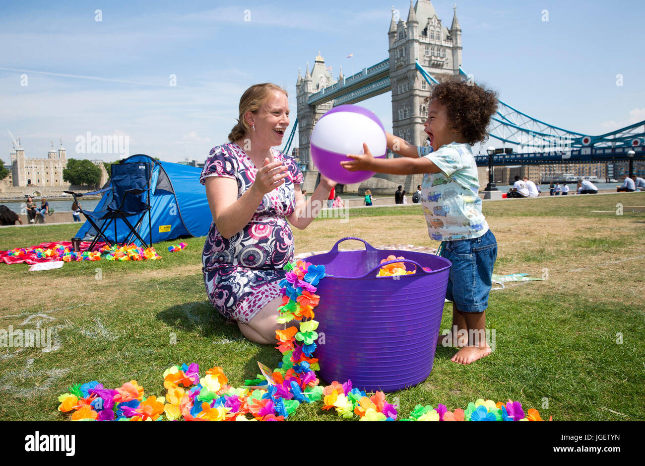 Sarah Gelli and her son Asher play with a ball during the launch of the Caravan and Motorhome Clubs Big Little Tent Festival at Potters Field, London, an initiative to get families to enjoy the great outdoors. Stock Photo