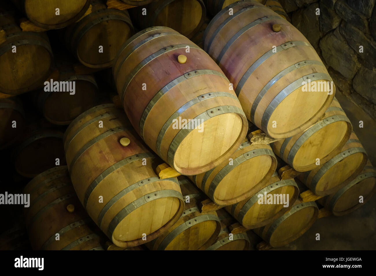 rows of wood wine barrels in a vintage winery cave Stock Photo - Alamy