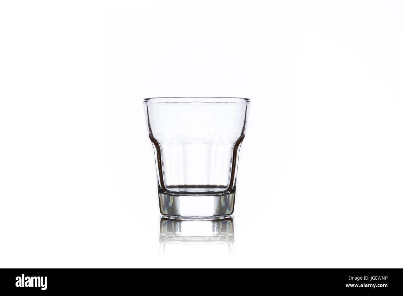 One clean empty shot glass isolated on white background Stock Photo - Alamy