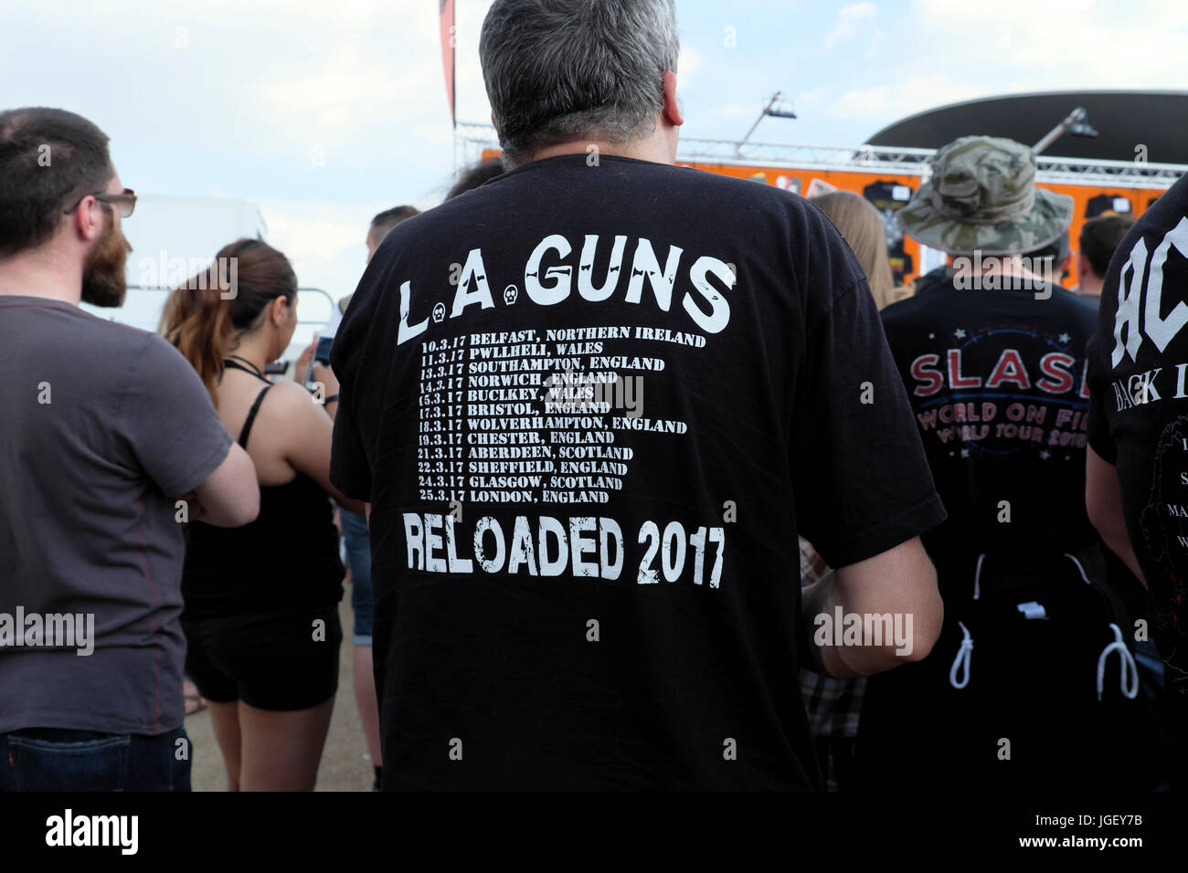 Guns N' Roses 2017 concert fan arrives at entrance of Olympic Park stadium  wearing LA Guns Reloaded t shirt in East London England UK KATHY DEWITT  Stock Photo - Alamy