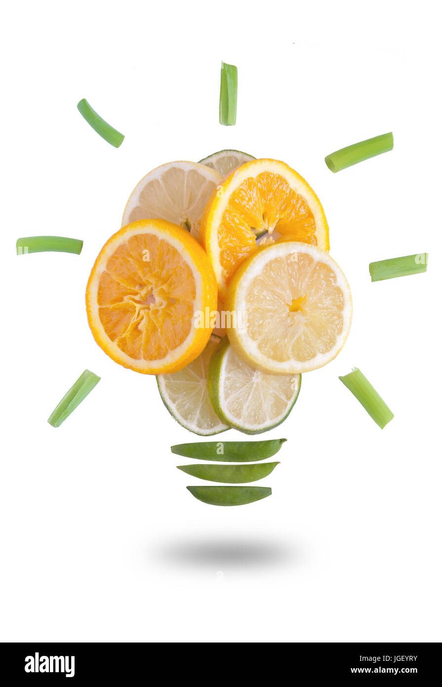 Light bulb made of fruits and vegetables over a white background Stock Photo