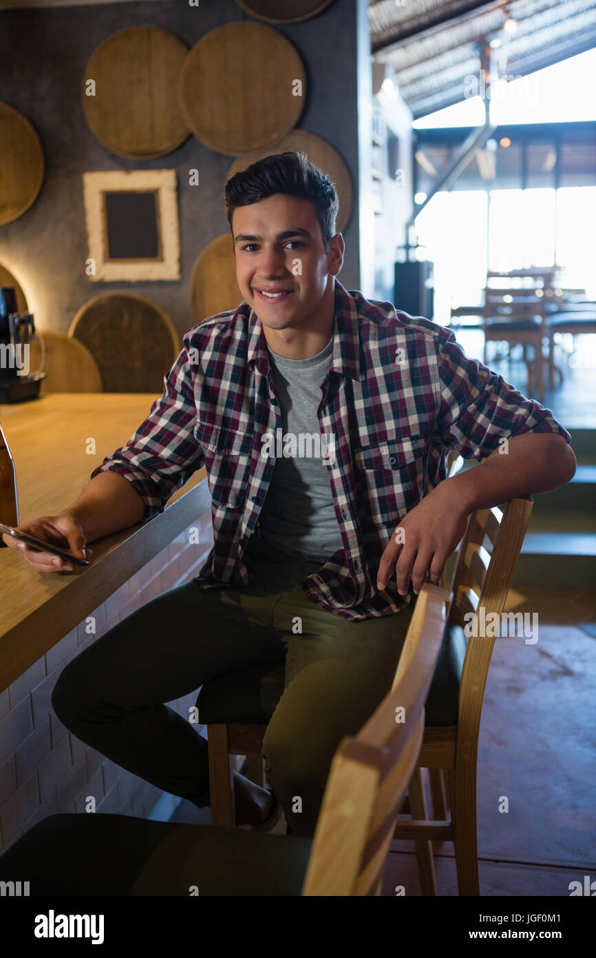 Man sitting on bar chair hi-res stock photography and images - Alamy