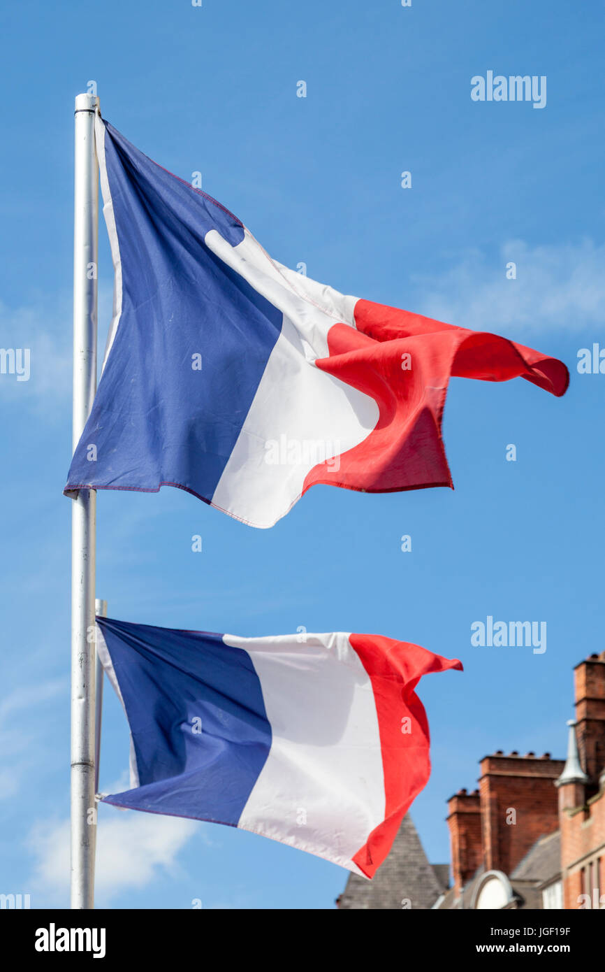 Two French flags blowing in the wind Stock Photo