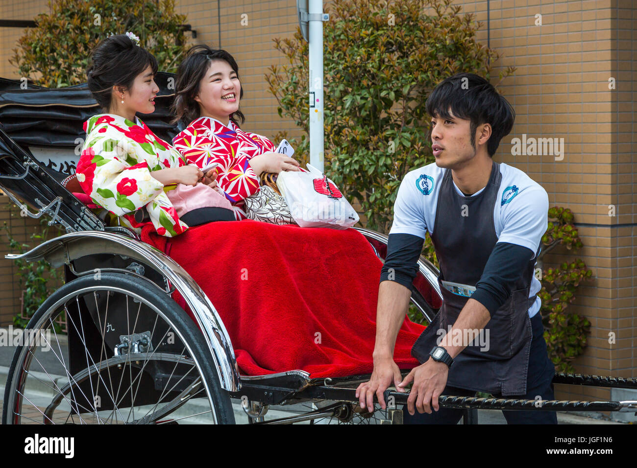 Girls In Traditional Dress In A Rickshaw In Asakusa Tokyo Japan Stock