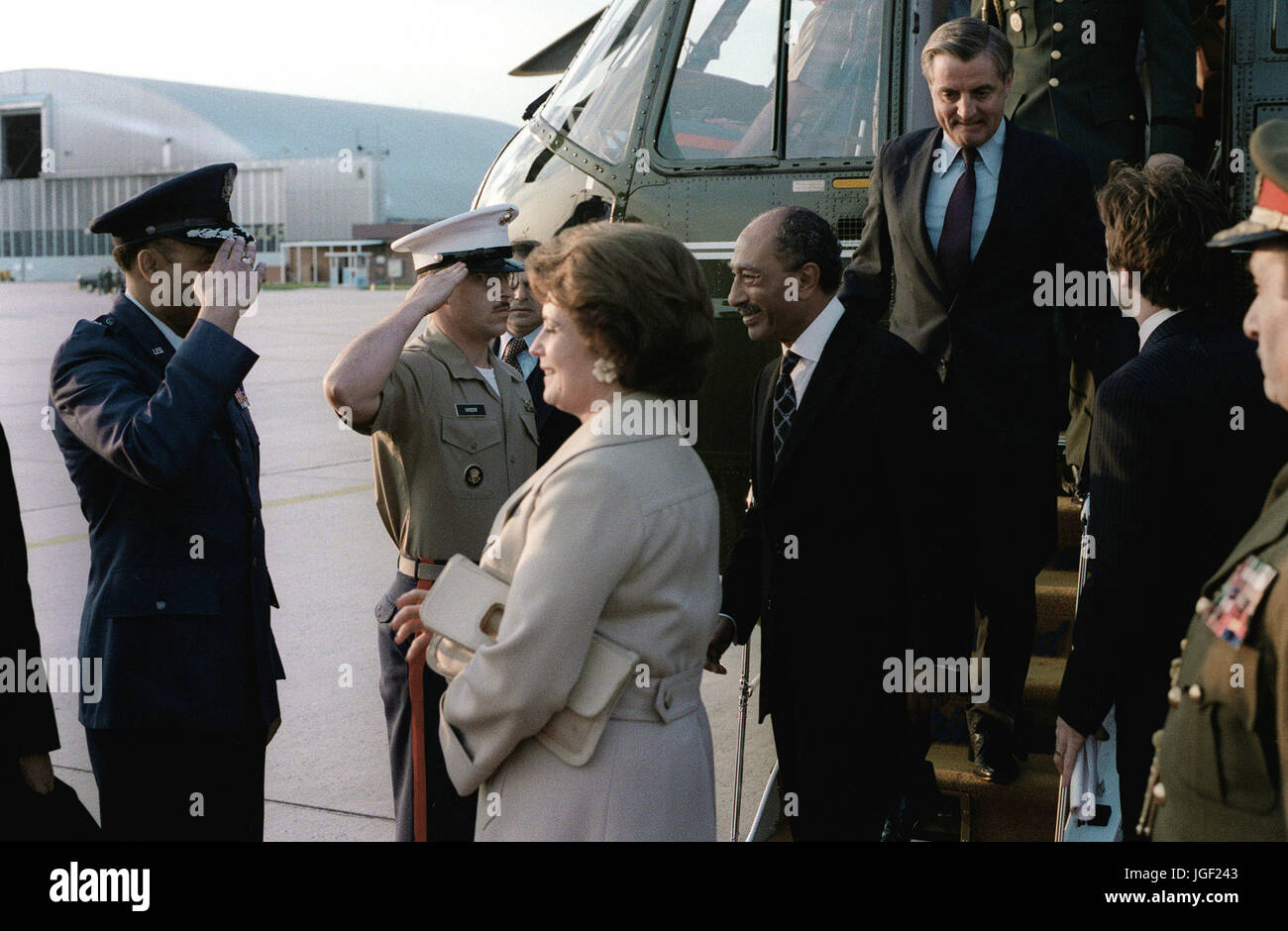 President and Mrs. Anwar Sadat of Egypt, escorted by Vice President Walter Mondale, arrive at the air terminal prior to their departure from the United States after their visit. Stock Photo