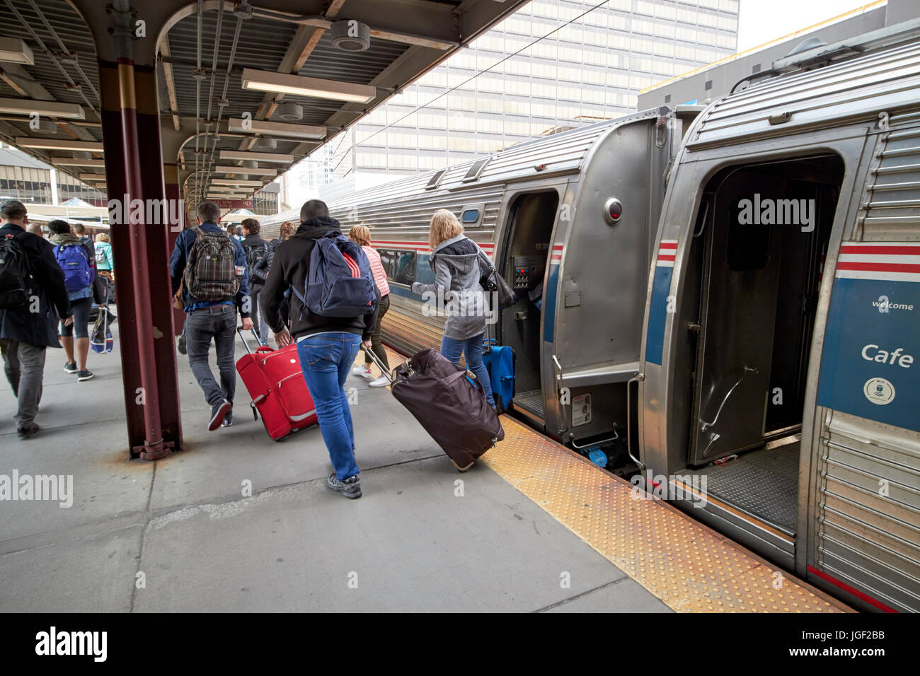 passengers disembark a local amtrak train at south station Boston USA Stock Photo