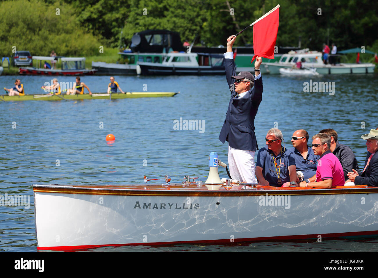 The umpire waves the red flag to start the race the final day of Henley Royal Regatta 2017 Stock Photo