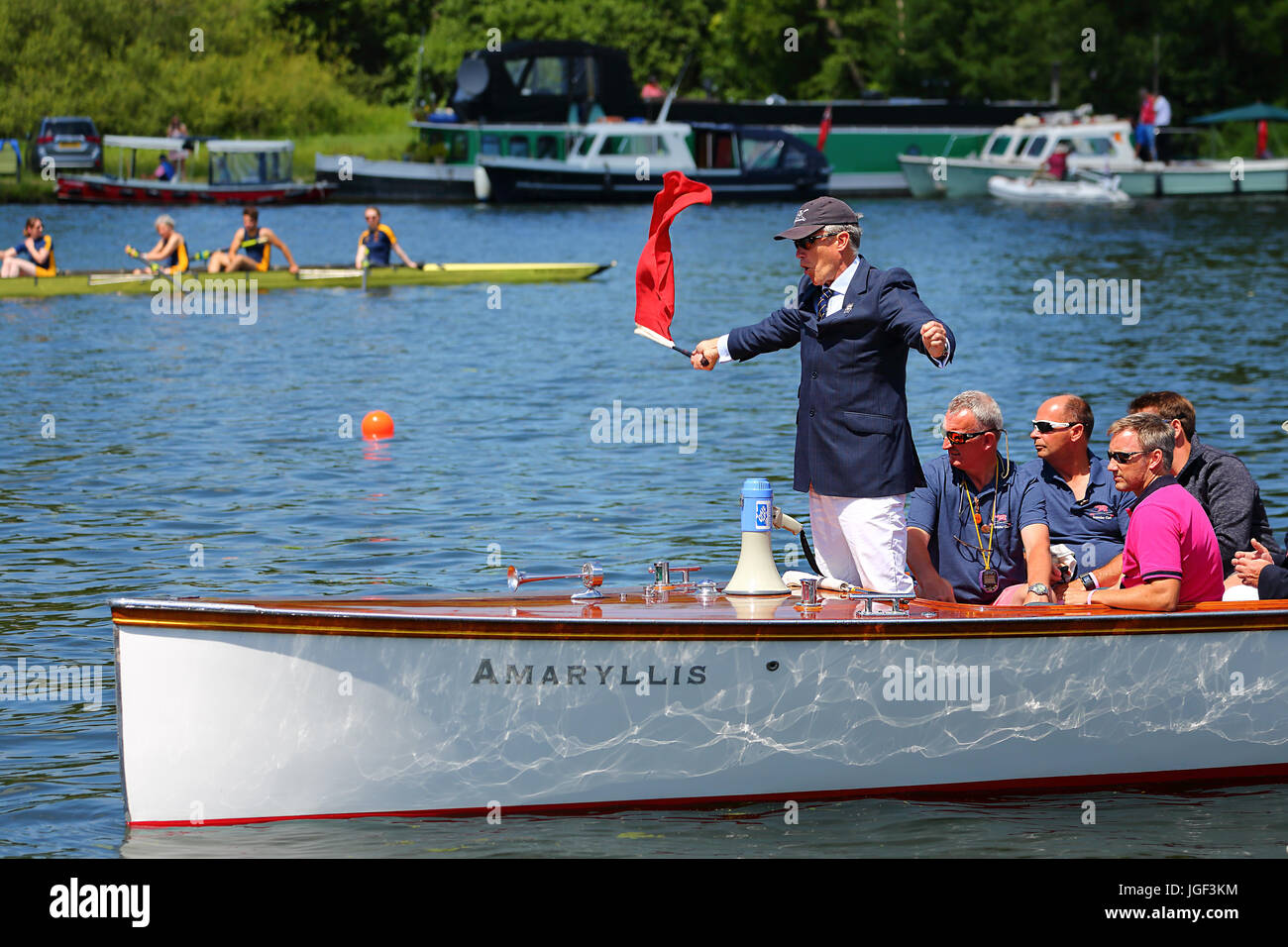 The umpire waves the red flag to start the race the final day of Henley Royal Regatta 2017 Stock Photo