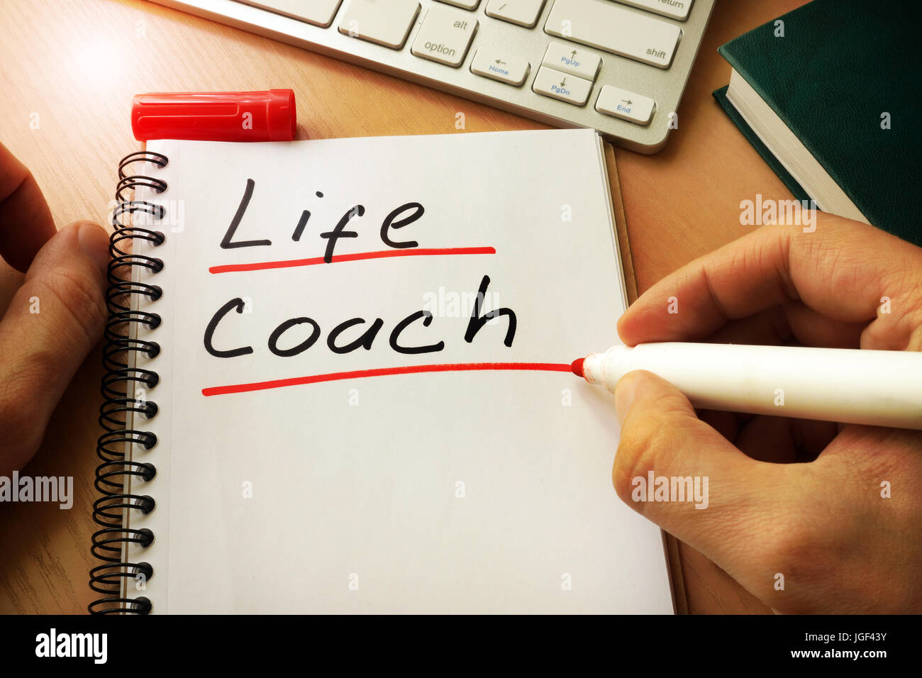 Notepad with handwriting title life coach. Stock Photo
