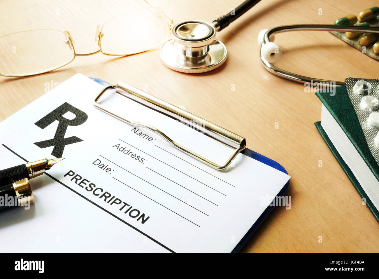 Doctor’s table with medical prescription form. Healthcare concept. Stock Photo