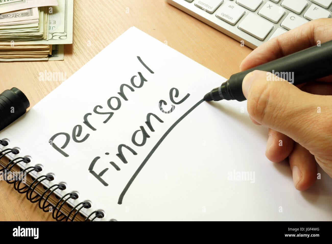 Personal finance handwritten in a note. Home budget concept. Stock Photo