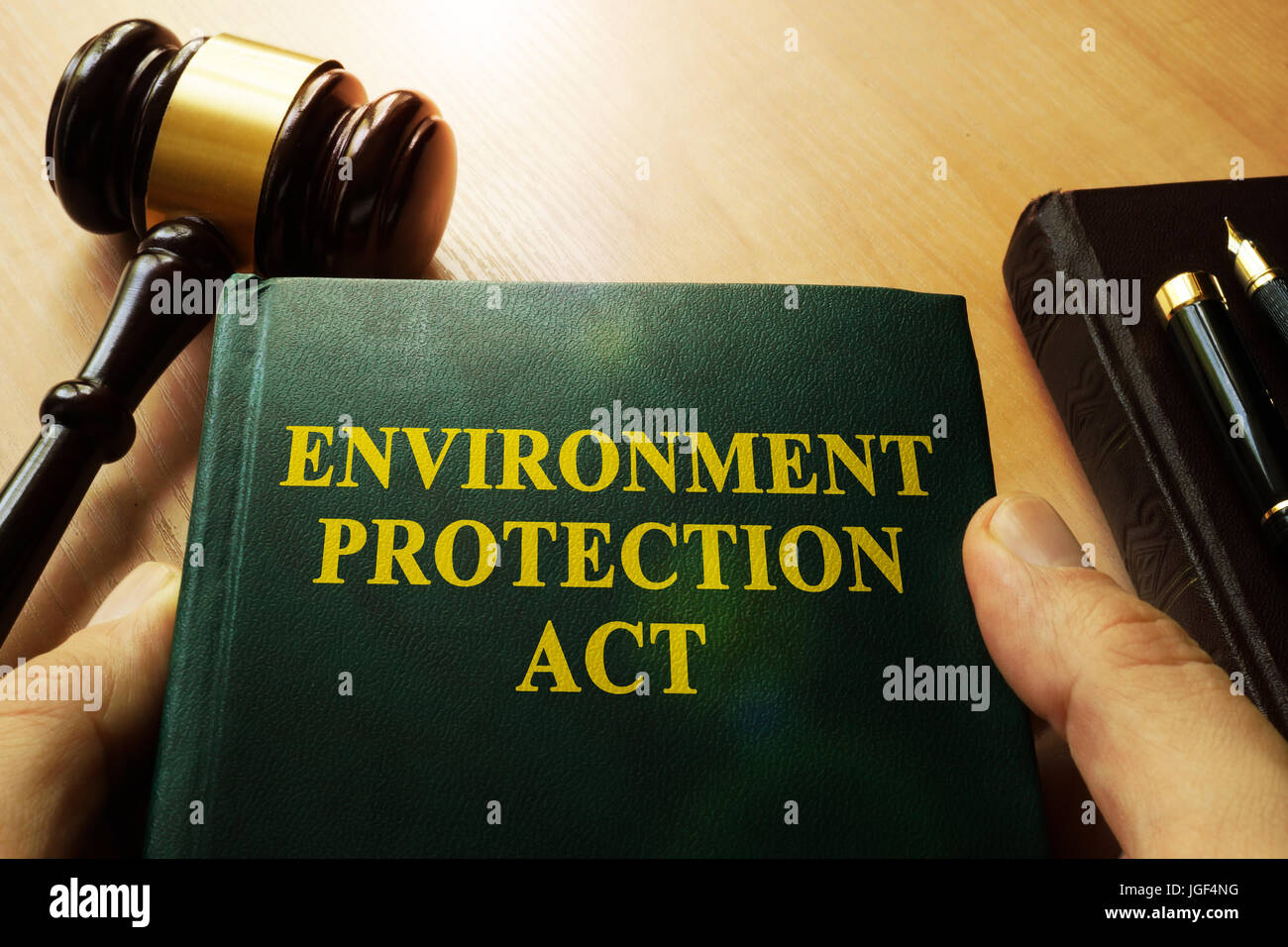 Hands holding environment protection act in a court. Stock Photo
