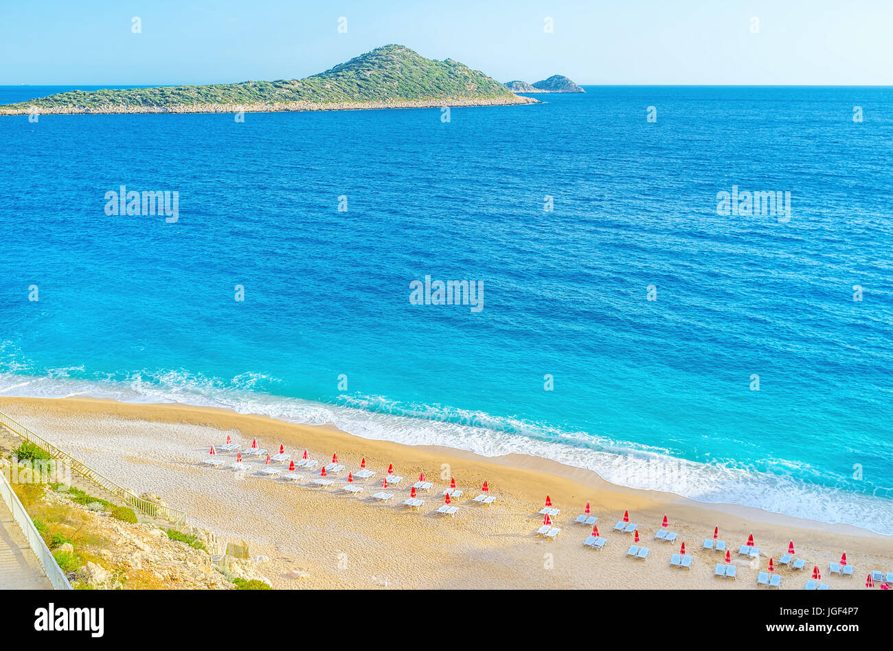 Kaputas beach offers comfortable sunbeds, sandy beach and relax waves of Mediterranean sea, Kalkan, Turkey Stock Photo