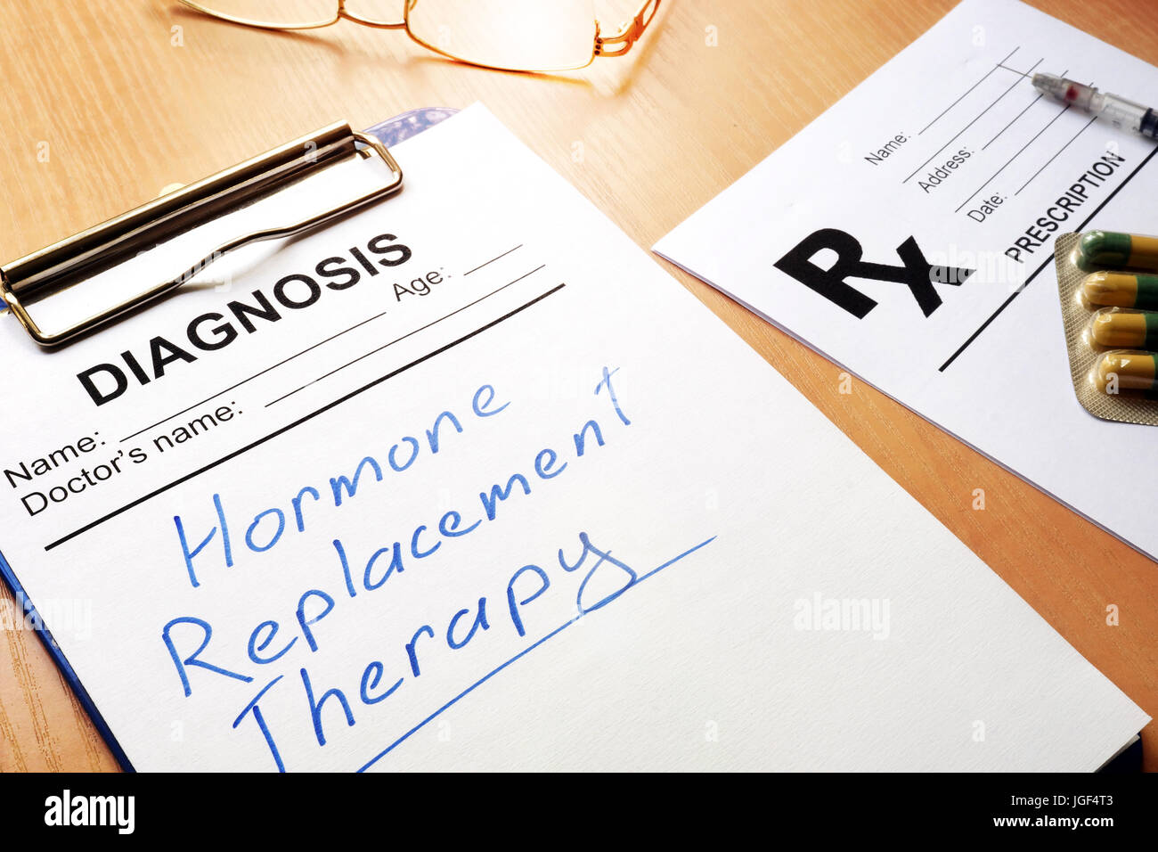 Clipboard with medical form and sign Hormone Replacement Therapy. Stock Photo