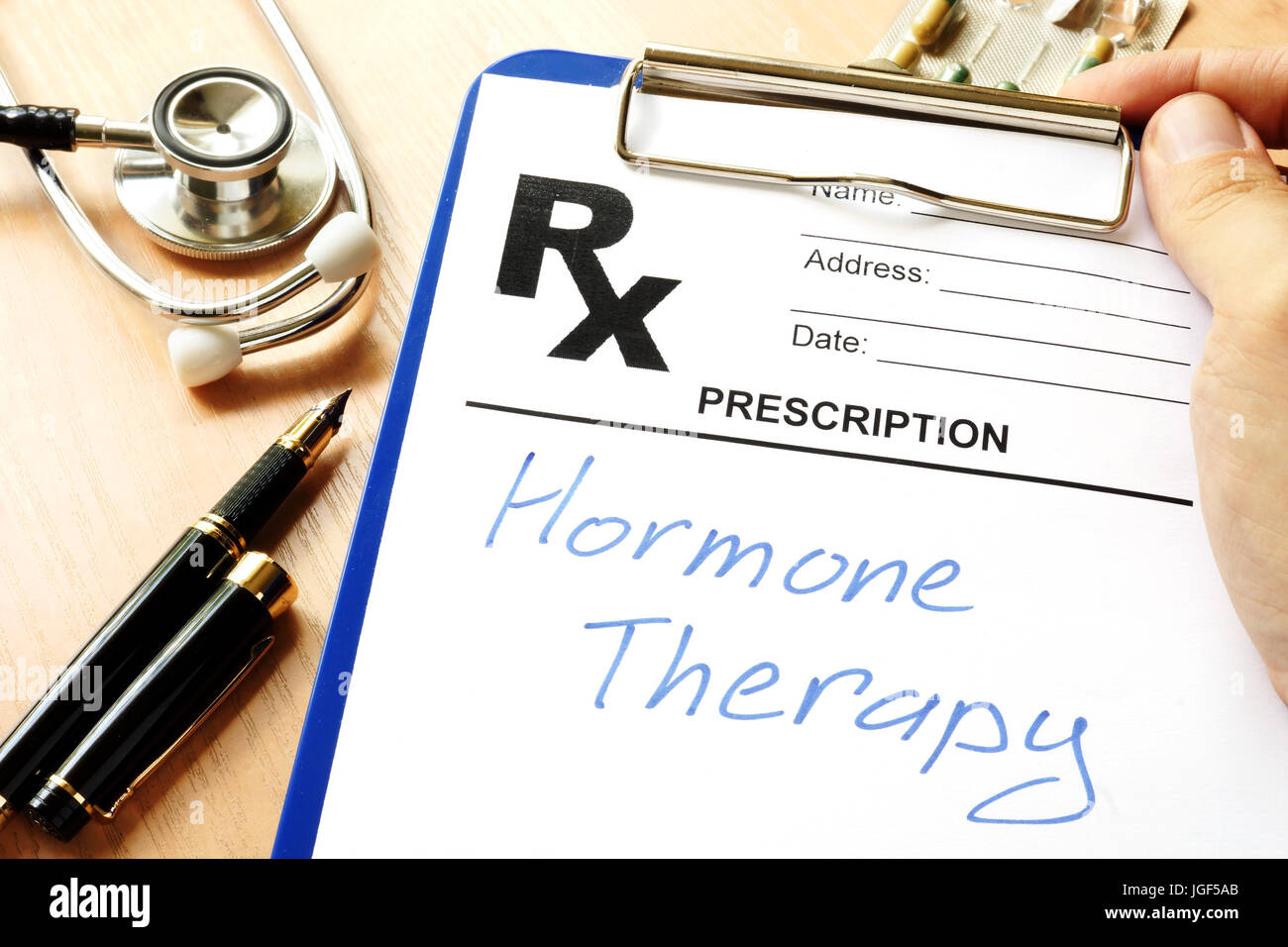 Prescription form with sign hormone therapy. Stock Photo