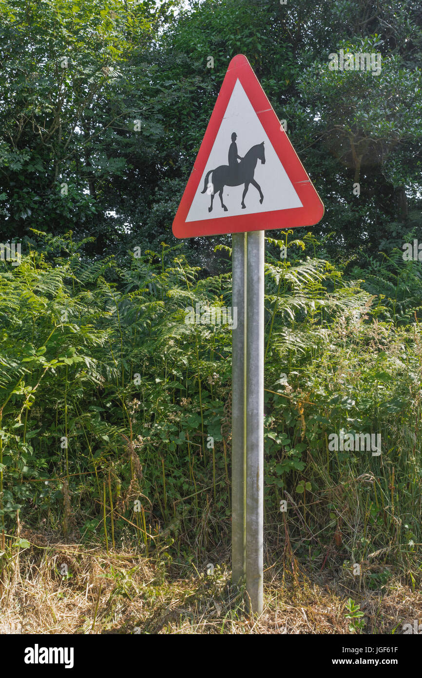 Triangular warning sign  - horses or equestrian stables nearby / using road. Country roadsigns UK. Stock Photo