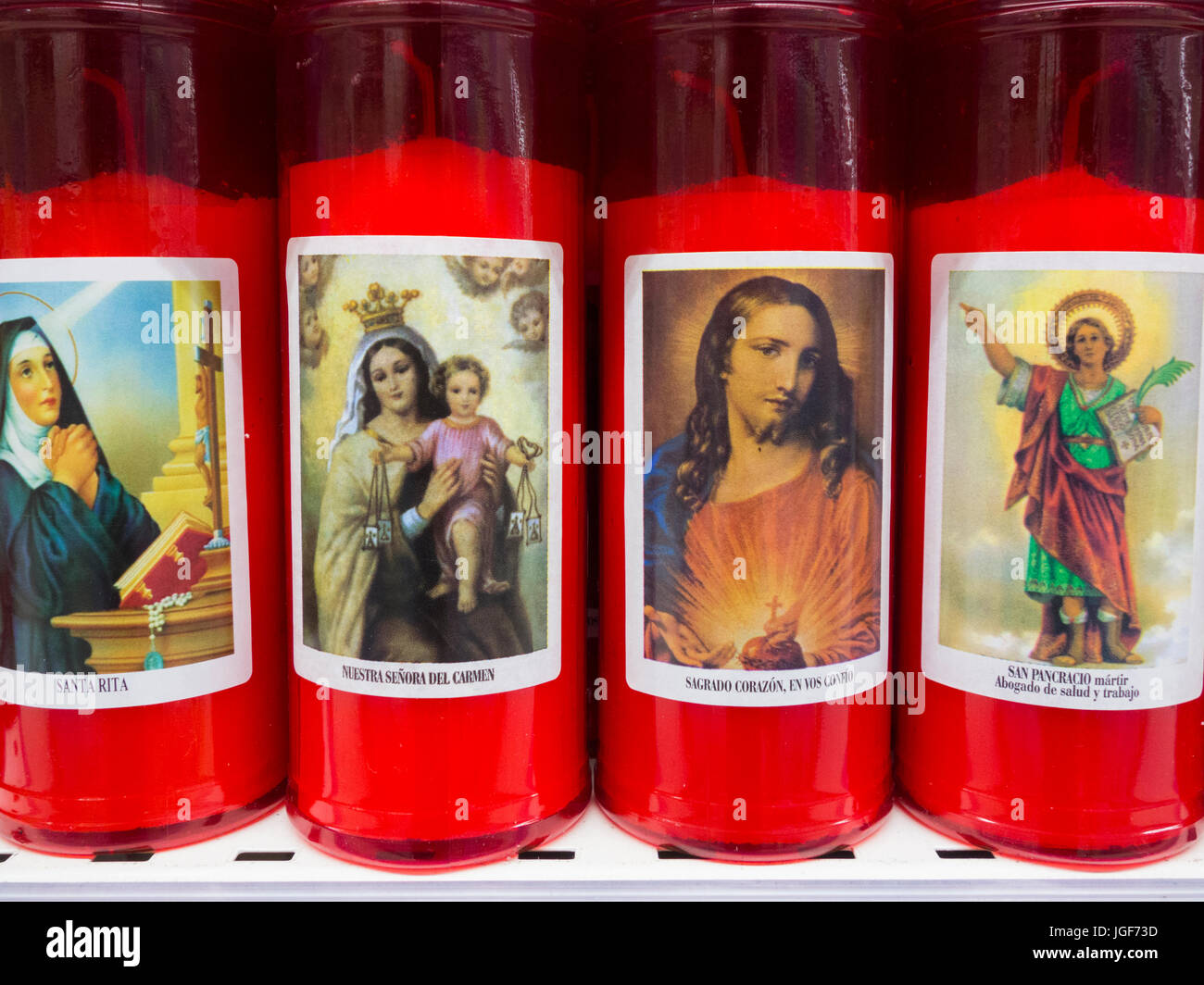 Spanish Ritual Candles Religion themed candles on market in Spain Stock Photo - Alamy