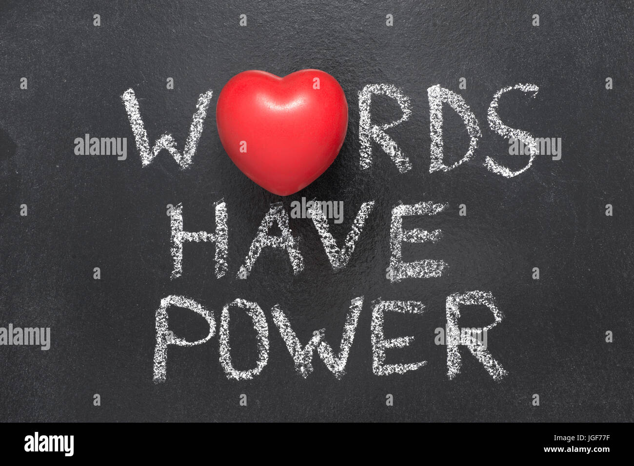words have power phrase handwritten on blackboard with heart symbol instead of O Stock Photo