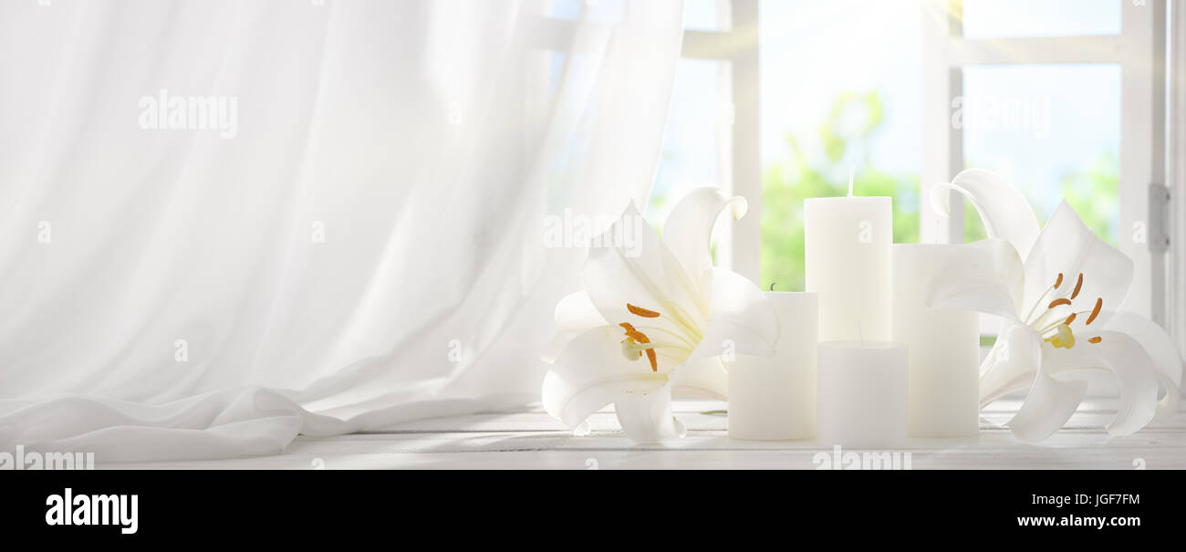 Picture frame near window with candle in the morning Stock Photo