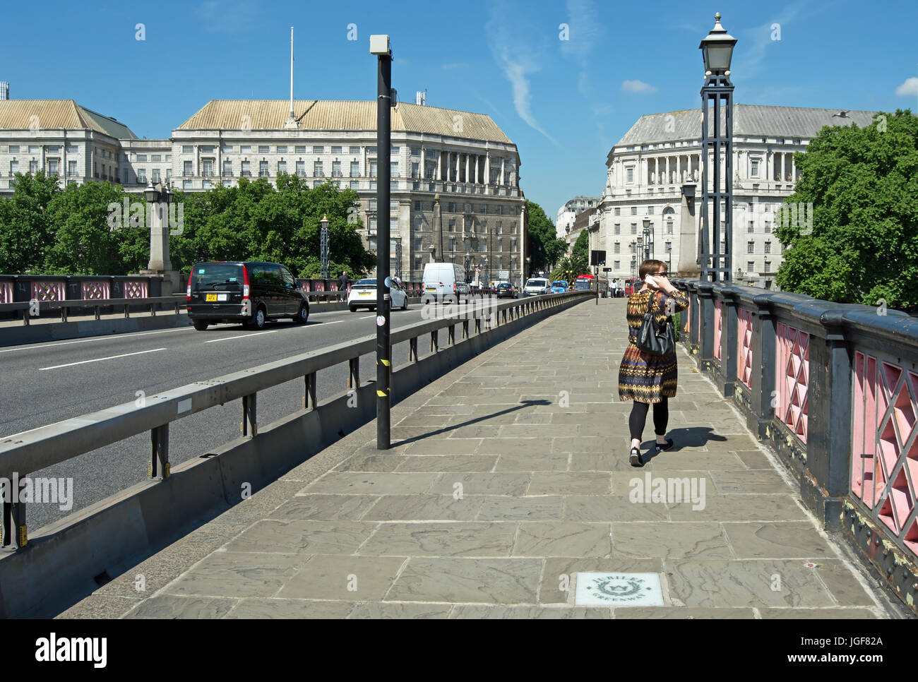 looking north across the east side of lambeth bridge, london, england, with jubilee greenway pavement plaque in foreground and thames house ahead Stock Photo