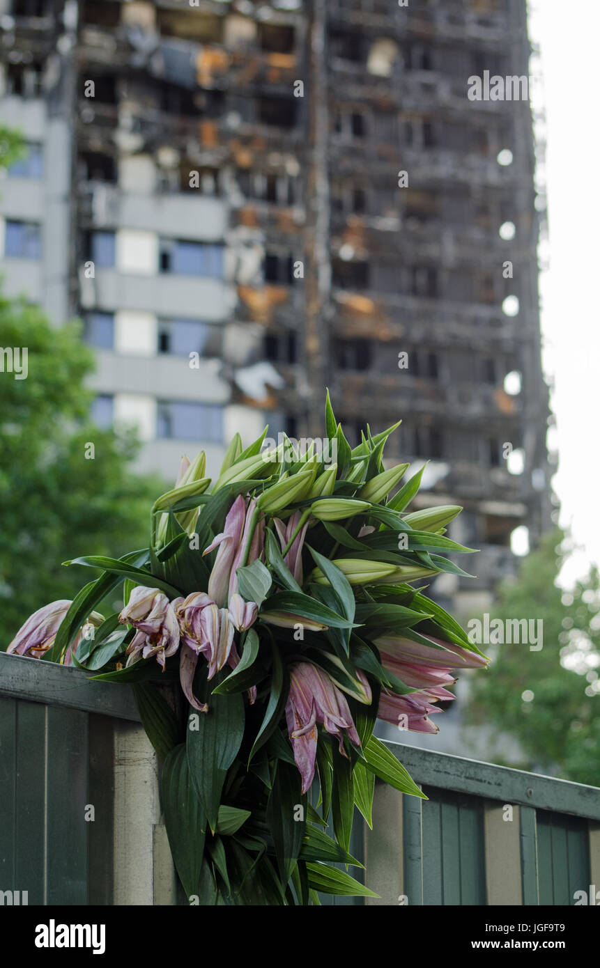 A bunch of lillies placed in memory of the 80 feared killed in the Grenfell Tower block fire in Kensington, North London. Stock Photo