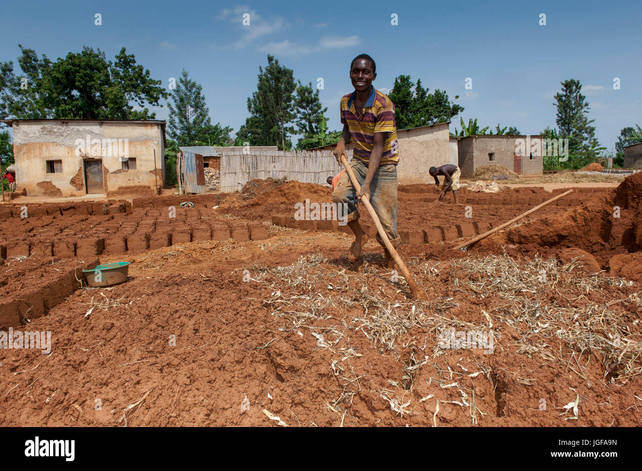 Making bricks out of clay and straw in a Rwandan village. Rwanda. Stock Photo