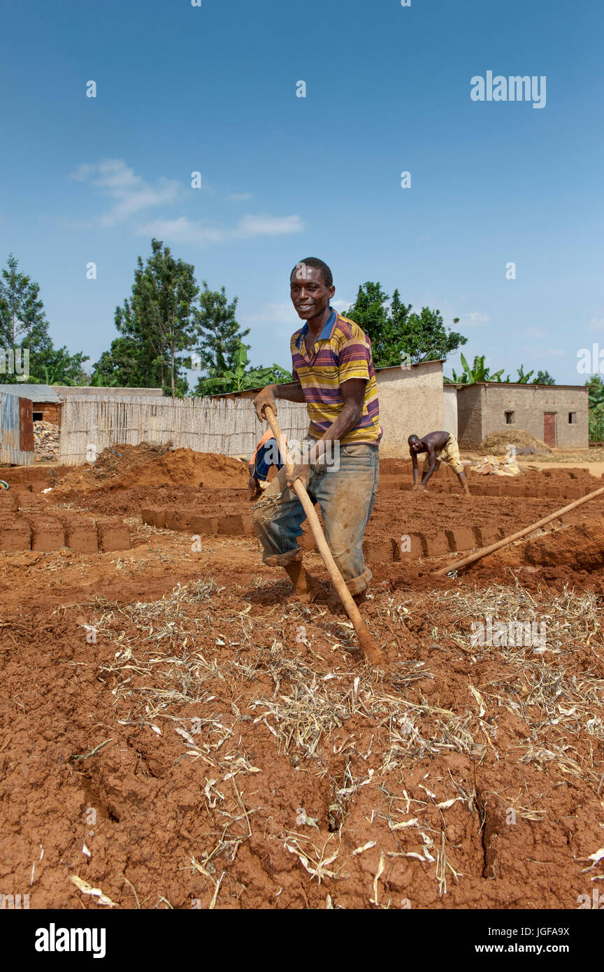 Making bricks out of clay and straw in a Rwandan village. Rwanda. Stock Photo