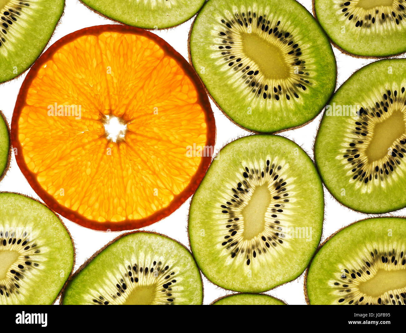 Kiwi with orange slices on the white background Stock Photo