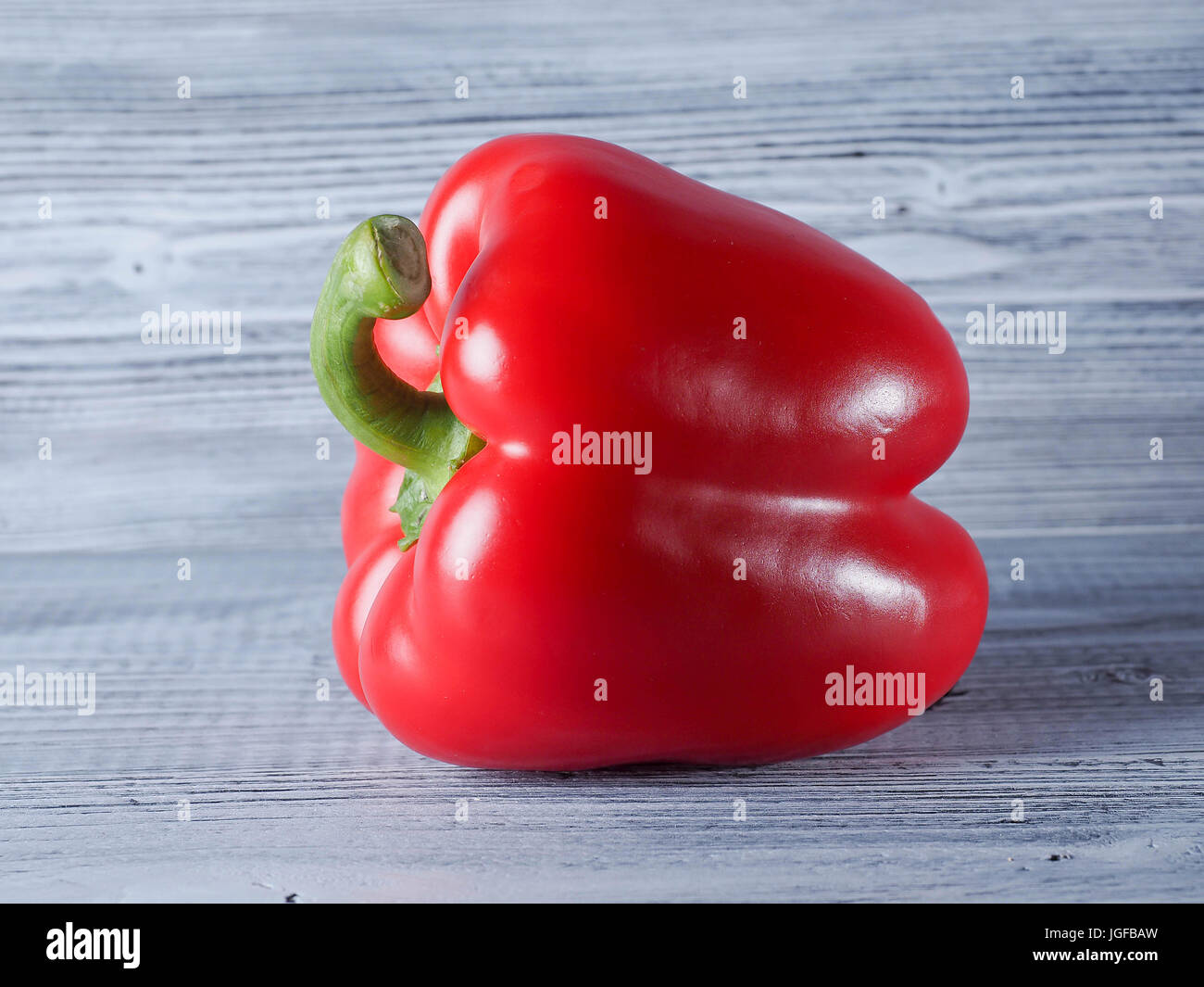 Fresh red paprika on the wooden background Stock Photo