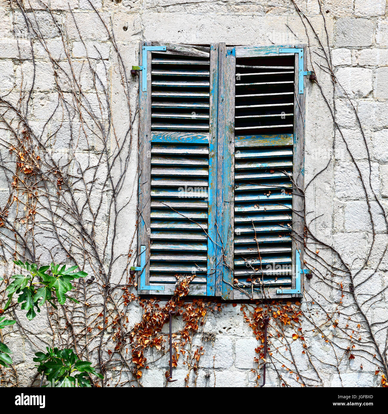 Old houses Old house window with closed shutters Stock Photo Alamy