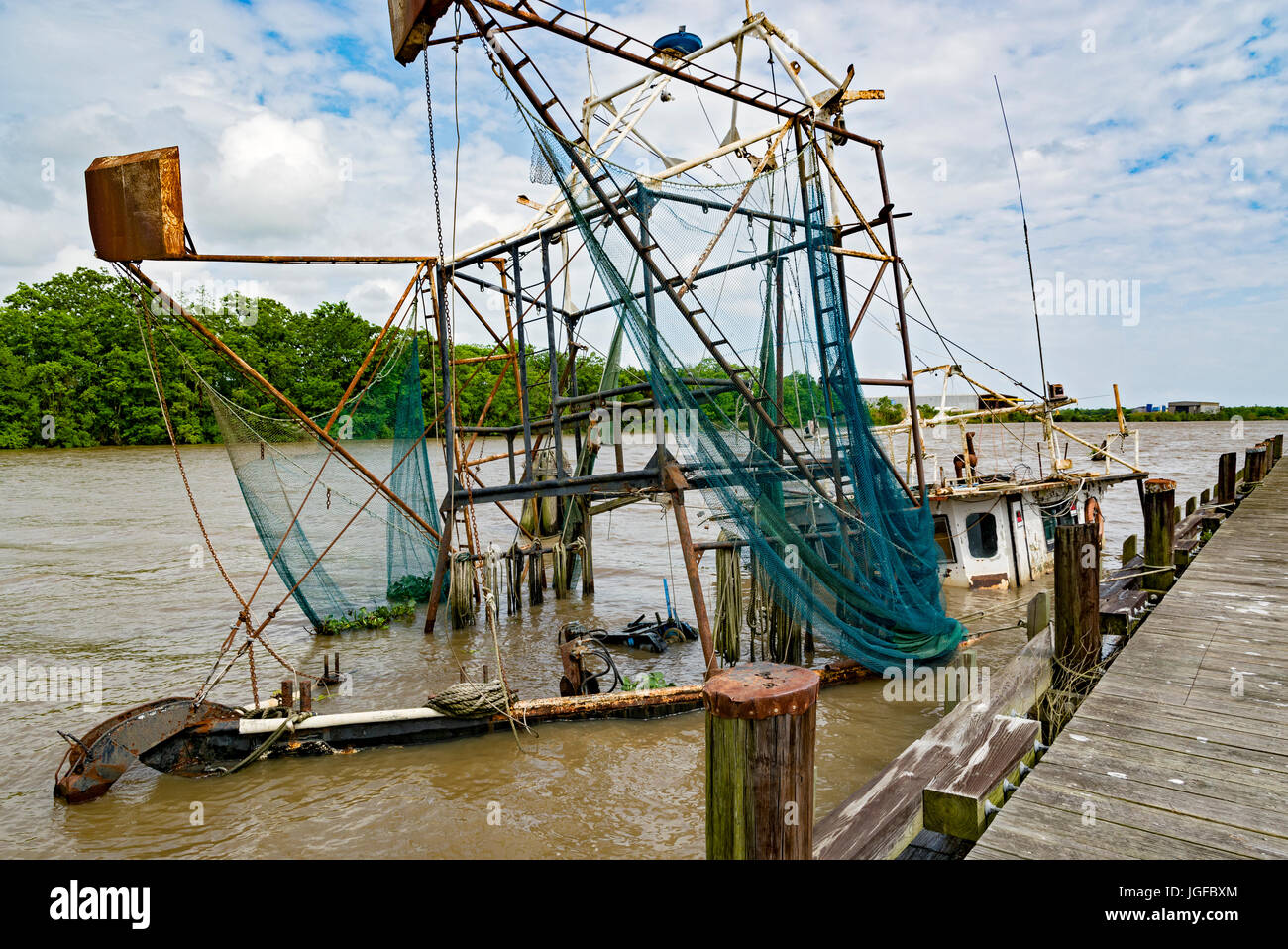 Louisiana, Iberia Parish, Delcambre Canal aka Bayou Carlin, commercial fishing boat sunk at dock Stock Photo