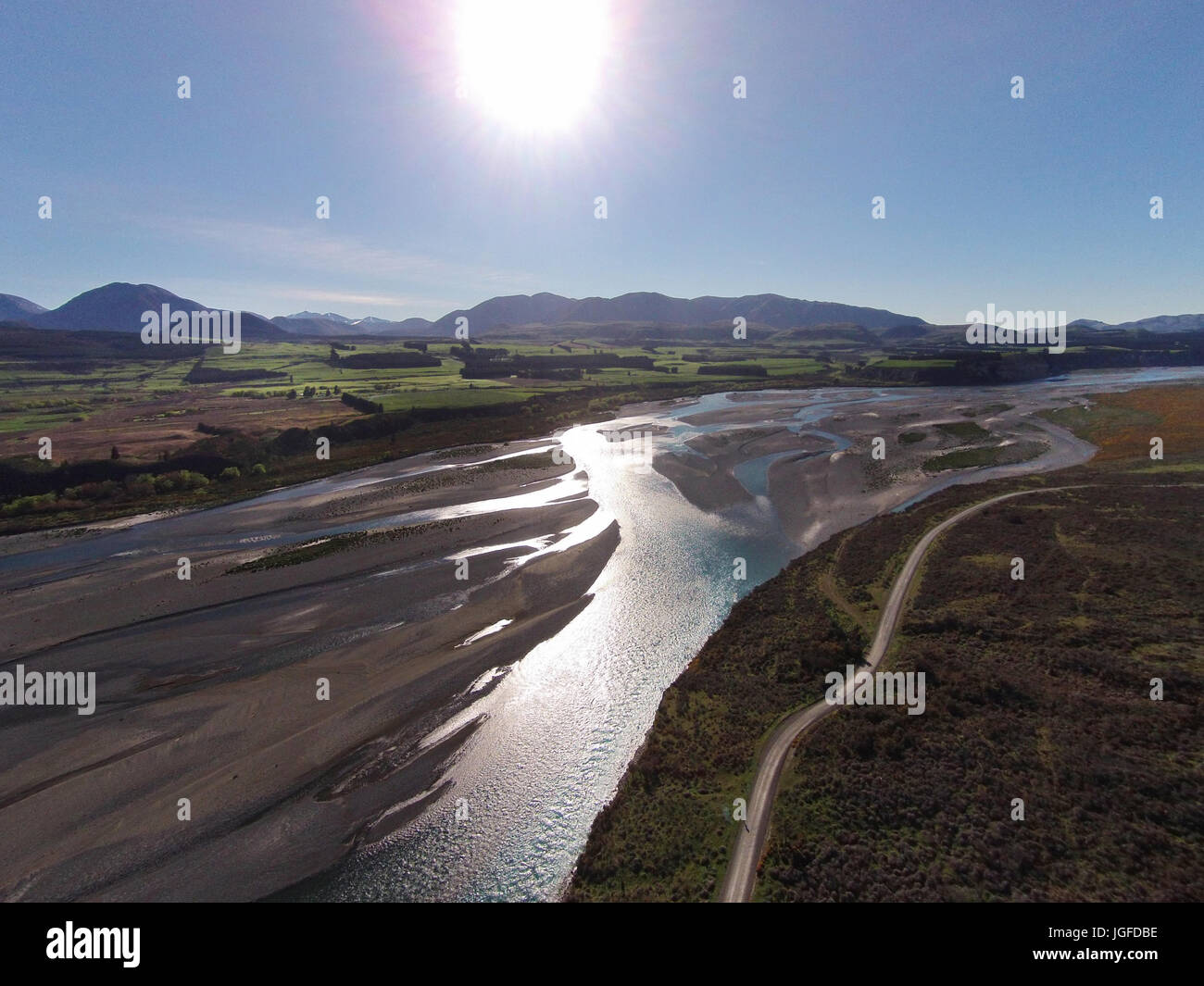 Braided streams of the Rakaia River, and Double Hill Run Road, Canterbury, South Island, New Zealand - drone aerial Stock Photo