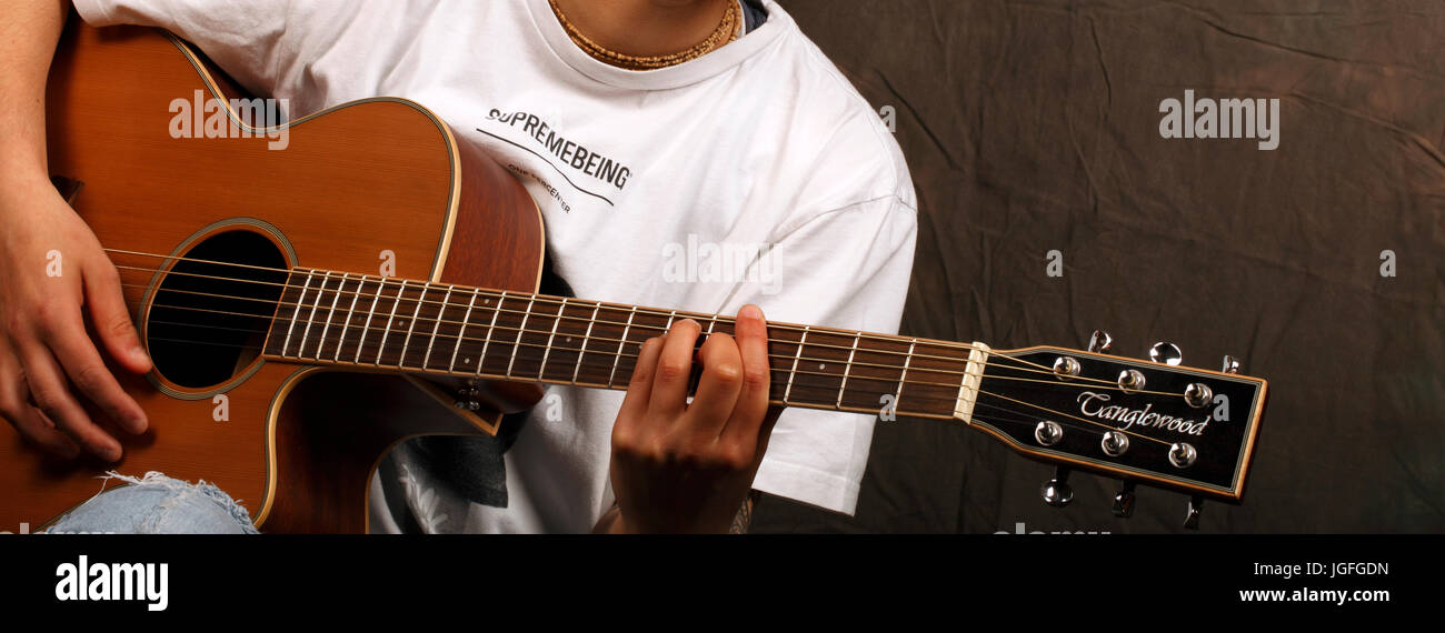 close up of classical or Spanish guitar player, playing the instrument. Stock Photo