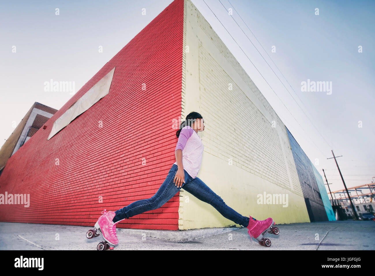 Black woman wearing roller skates gliding around corner Stock Photo Alamy