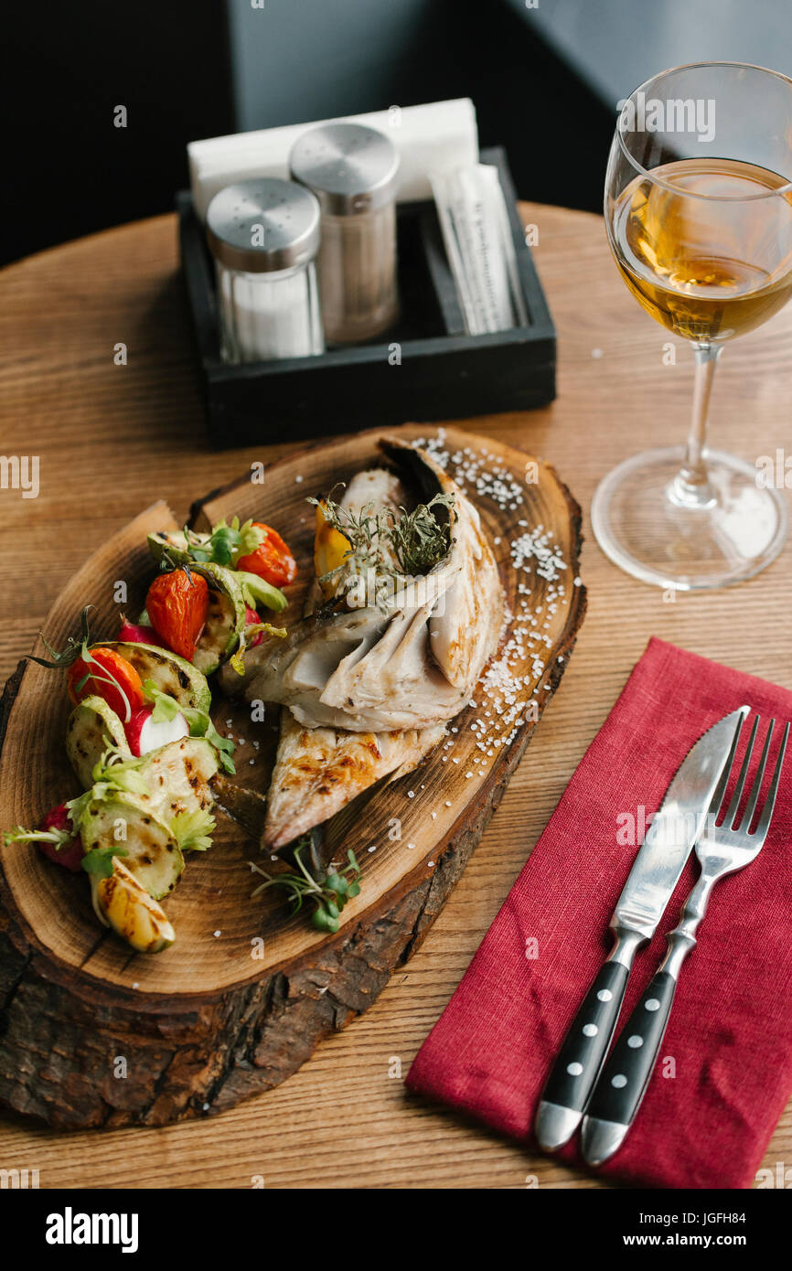 Fish and vegetables with white wine Stock Photo