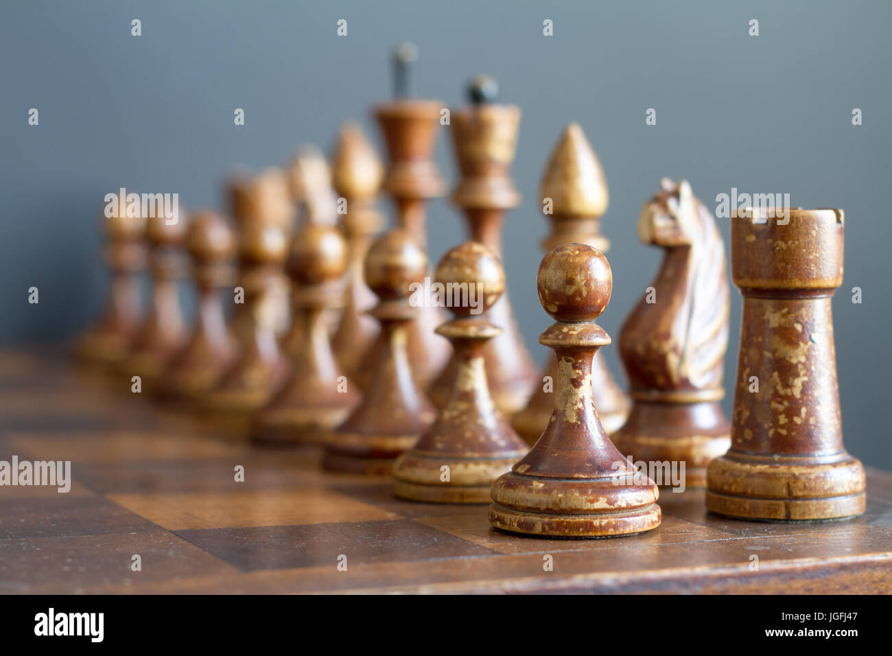 Ancient wooden chess pieces on an old chessboard Stock Photo - Alamy