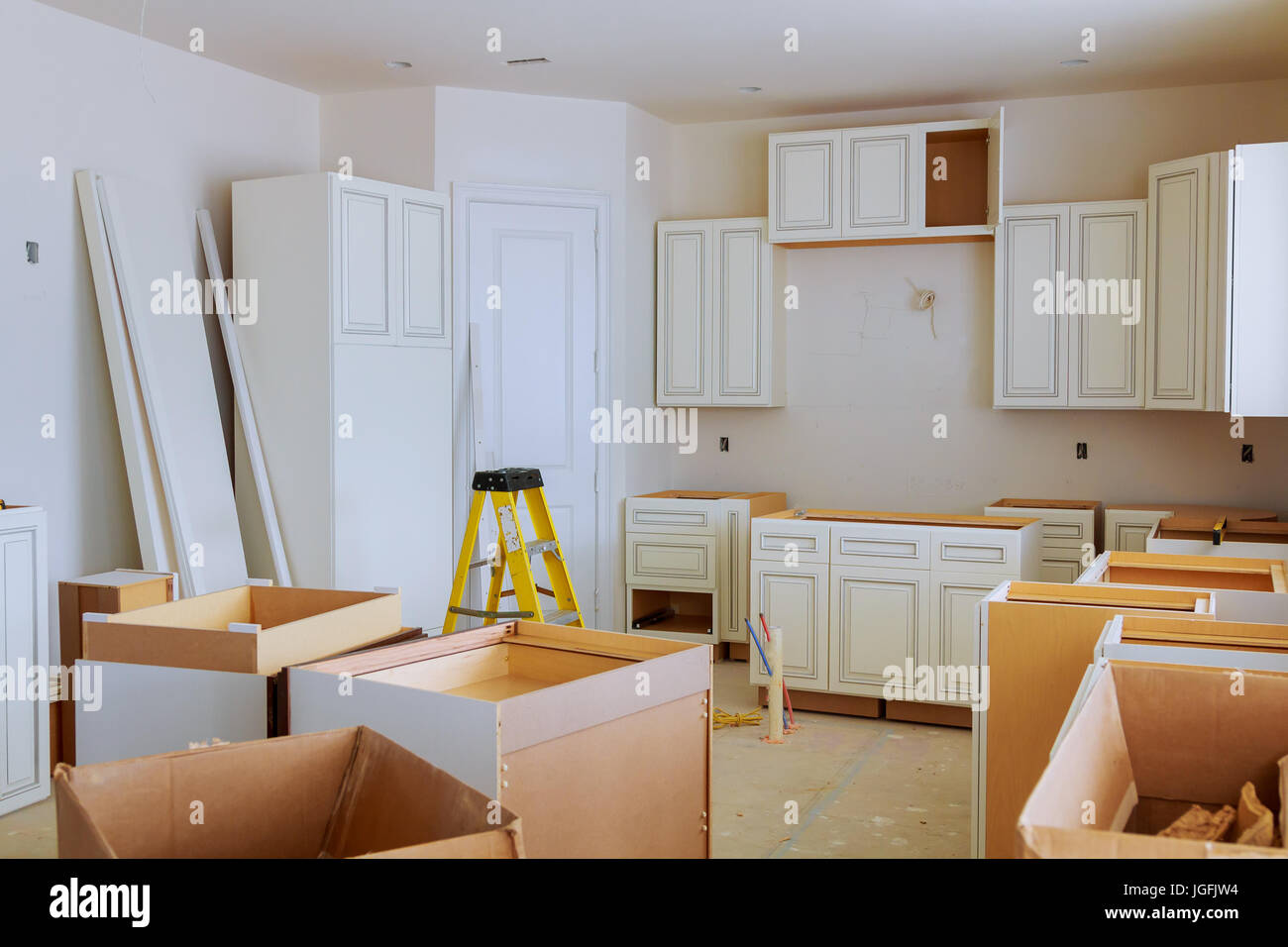 Image showcasing Custom kitchen cabinets in various stages of installation base for ...