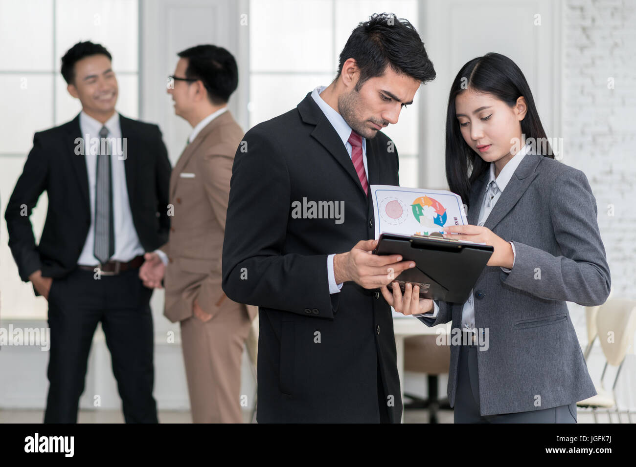 Group of muti Ethnicity business team meeting discussion in moddren office. Business team corporate organization meeting concept. Stock Photo