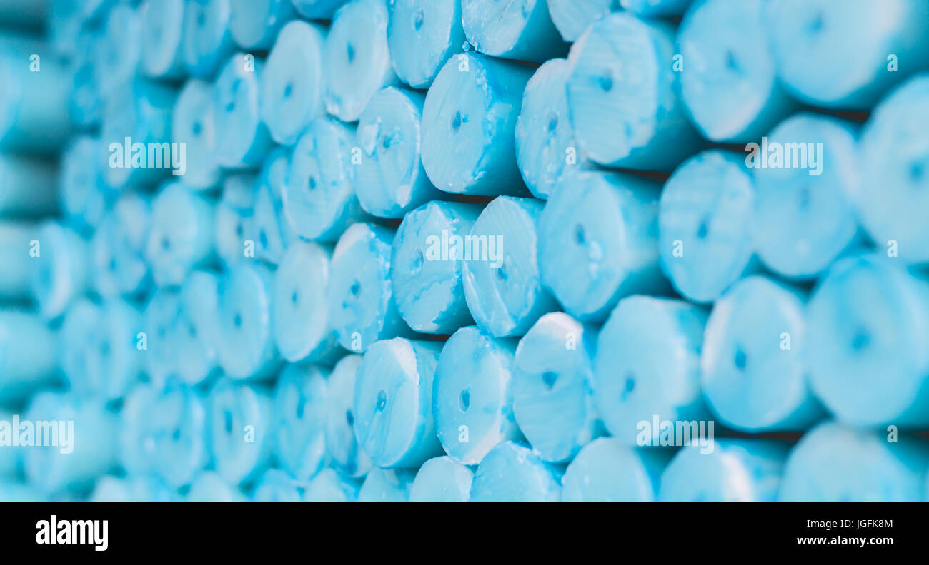 blue prayer candles stacked in Lourdes to sell, religious symbol Stock