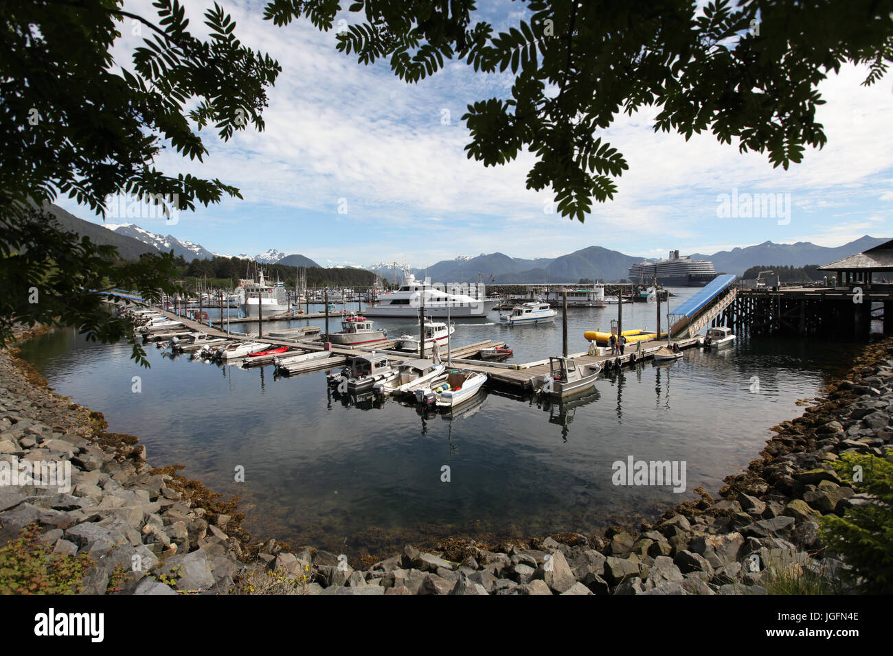Boats line docks in a cove at a marina in Sitka, Alaska. Stock Photo