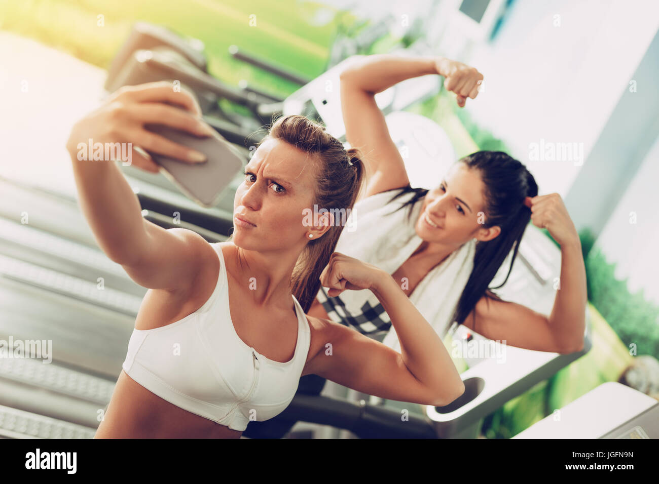 Funny Female Friends Taking Selfie After Workout On The Funny Female Friends Taking Selfie After Workout On The
