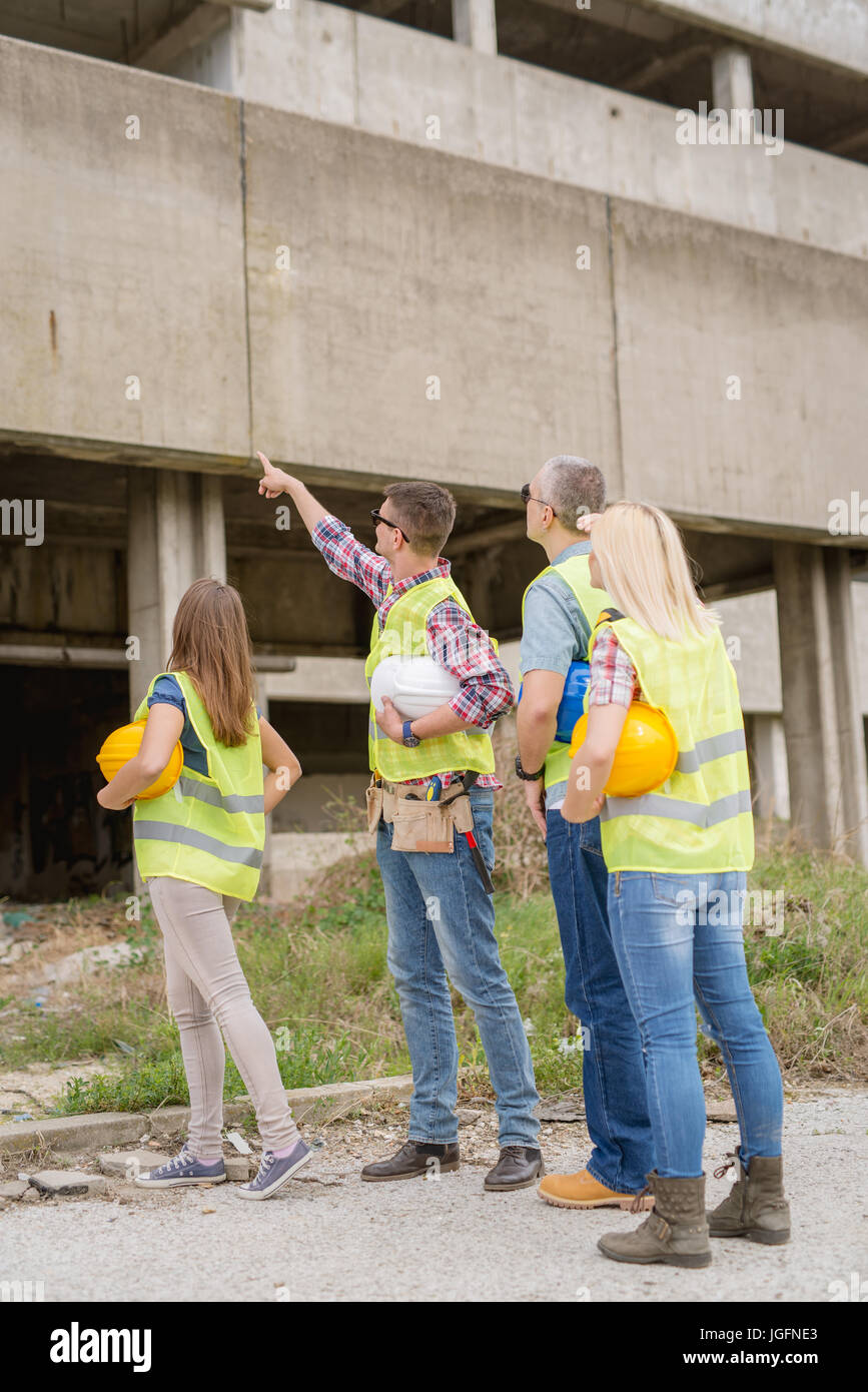Builder man checking vertical hi-res stock photography and images - Alamy