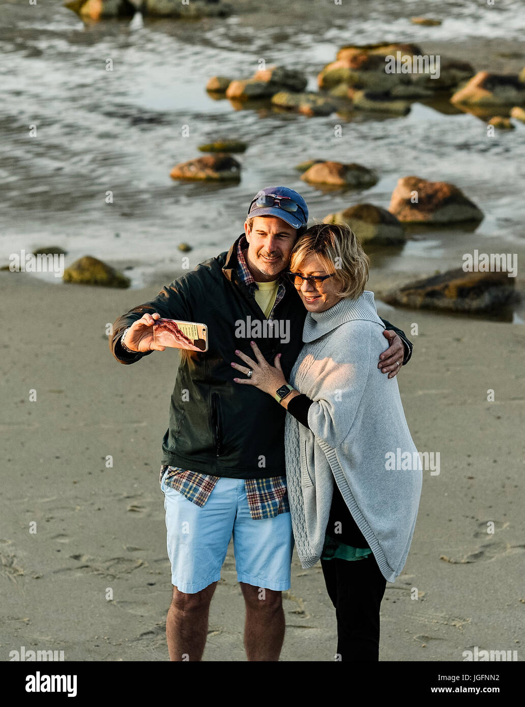 Couple posing for a selfie at the beach. Stock Photo