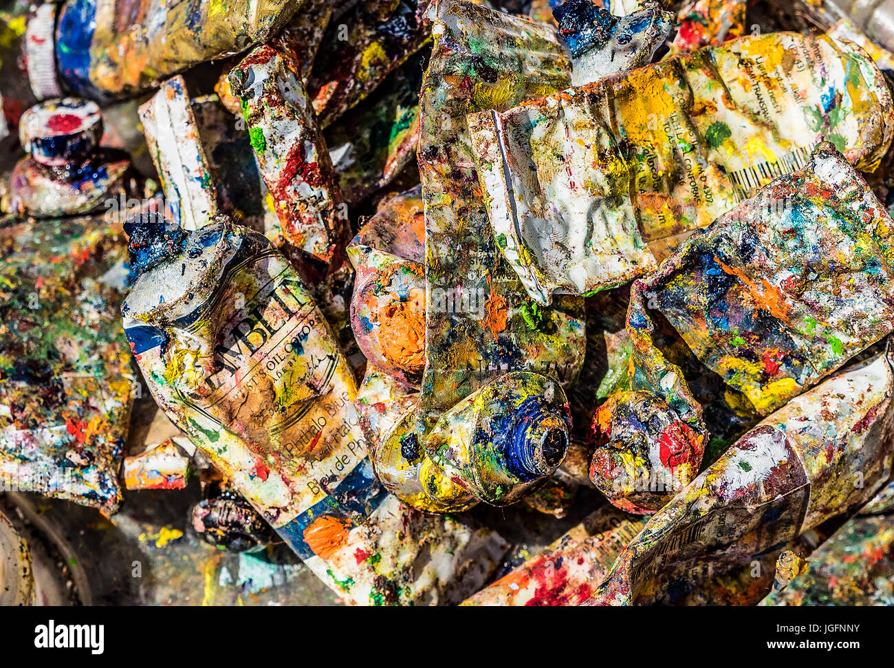 Used tubes of oil paint in an artist paint box. Stock Photo