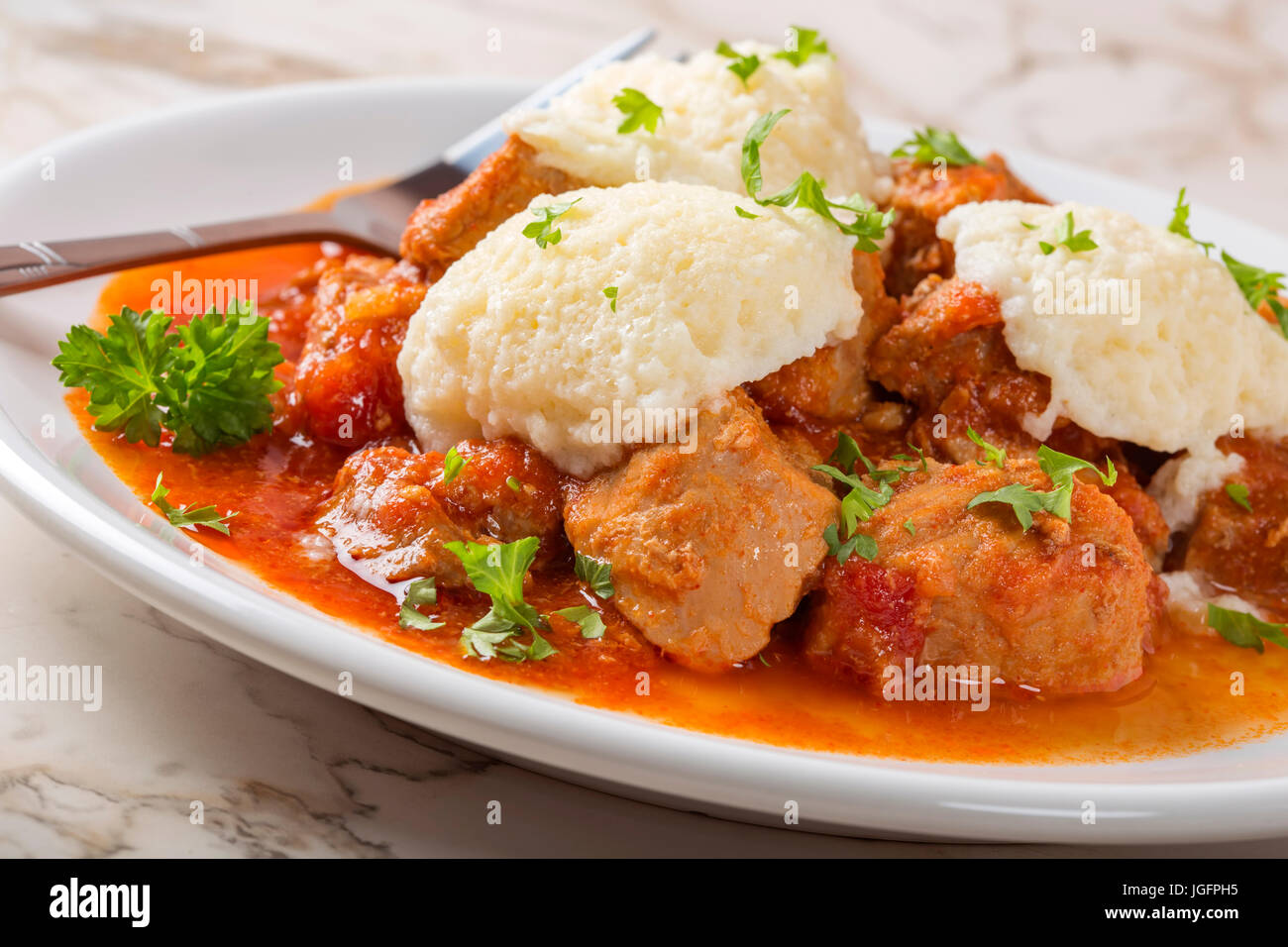 Classic goulash with dumplings, delicious heavy food, with dumplings Stock Photo
