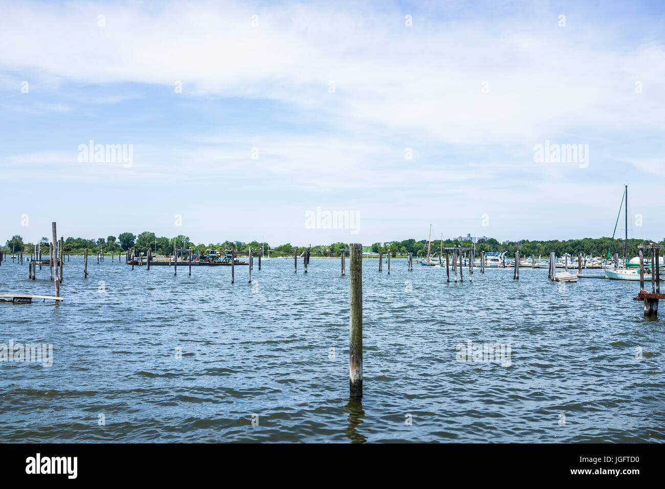 Bronx, USA - June 11, 2017: City Island harbor with boats and old, decaying pier Stock Photo