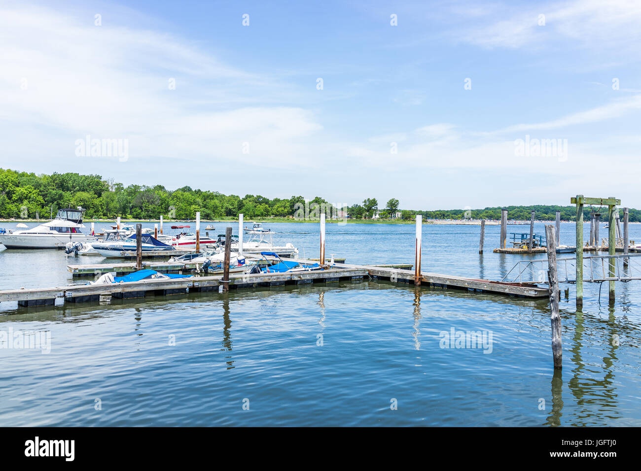 Bronx, USA - June 11, 2017: City Island harbor with boats and reflection Stock Photo