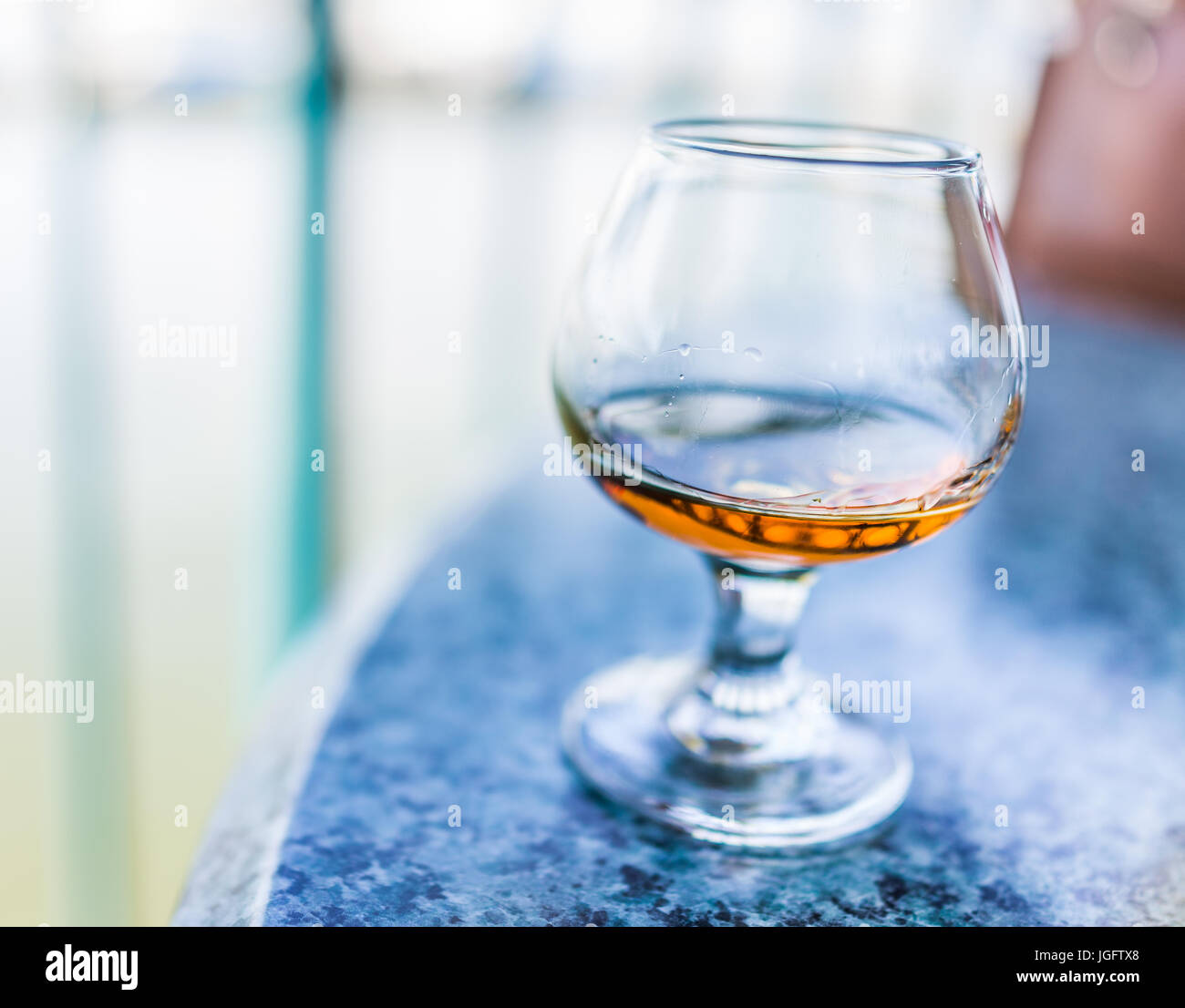 Macro closeup of amaretto, rum, or bourbon drink in glass Stock Photo